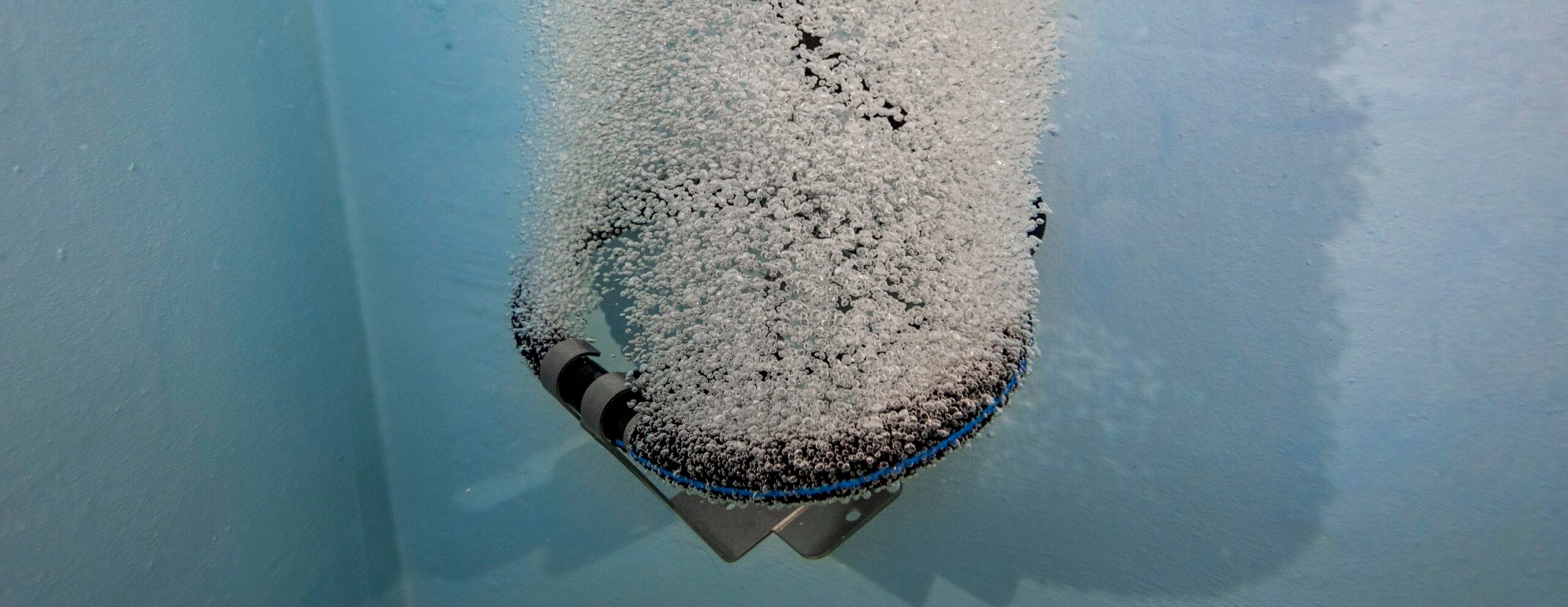 Kasco Marine HydraForce single-loop diffuser releasing fine bubbles in a wet well, supplied and serviced by EMS
